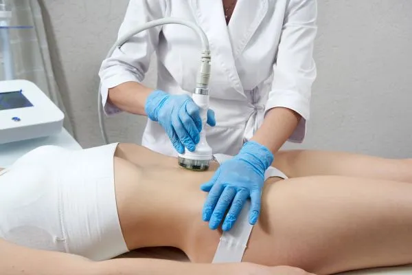 Lost the Weight but Not the Loose Skin? 2 woman having HIFU treatment on her stomach to combat loose skin Loughborough following weight loss